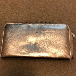 Rose gold wallet with a charging block